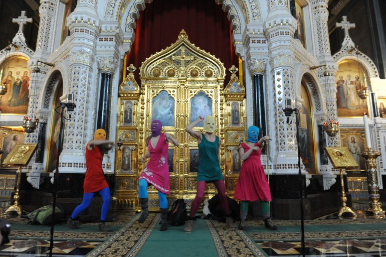 Feminist protesters marched by security out of Moscow cathedral for offensive performance. Aleshkovsky Mitya / Tass / picturedesk.com