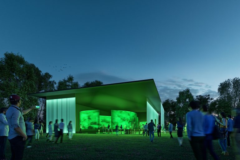 Der mobile Pavillon der STEIERMARK SCHAU (der Ersatz für die Landesausstellung)leuchtet grün in der Dämmerung.