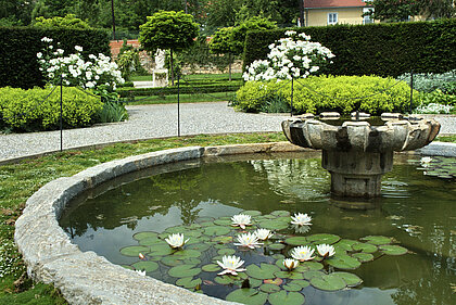 View of the fountain in the white moon garden in the Planetary Garden in Schloss Eggenberg.