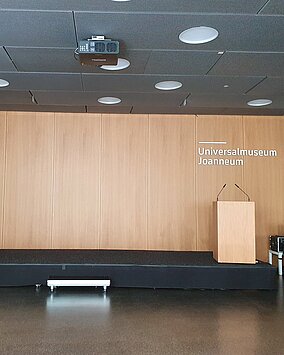 View of the stage with podium in the Auditorium in the Joanneumsviertel.