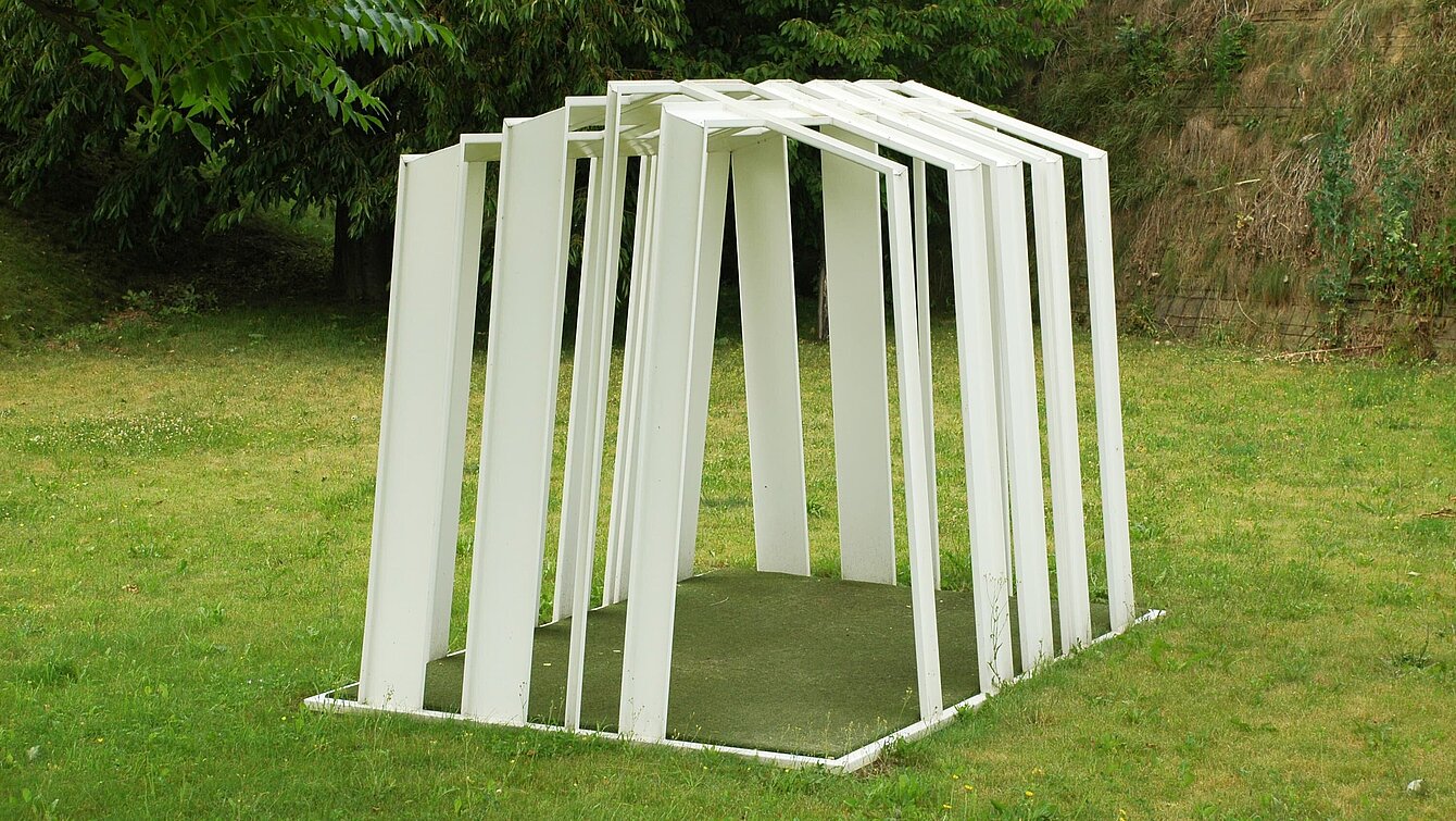 Erjautz constructs his sculpture as a building or tent made of white lines that have become metal, derived from computer bar codes. 