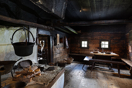 Smokey kitchen with fireplace and table