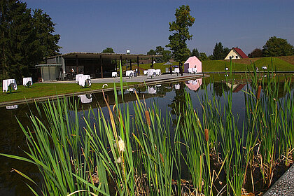 View across the water to the Berggartencafé in the Austrian Sculpture Park.