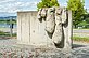 The sculpture by the painter Bohatsch is a vertical, smooth concrete slab with "drops" of concrete hanging down. These resemble fingers and are intended to simulate the paint slowly creeping across the canvas.