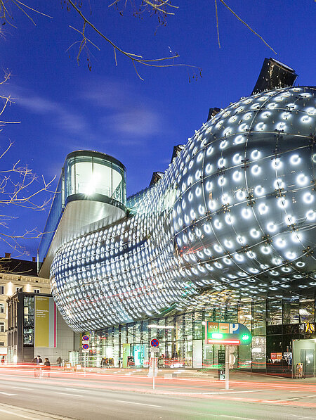View of the Kunsthaus Graz at night. 