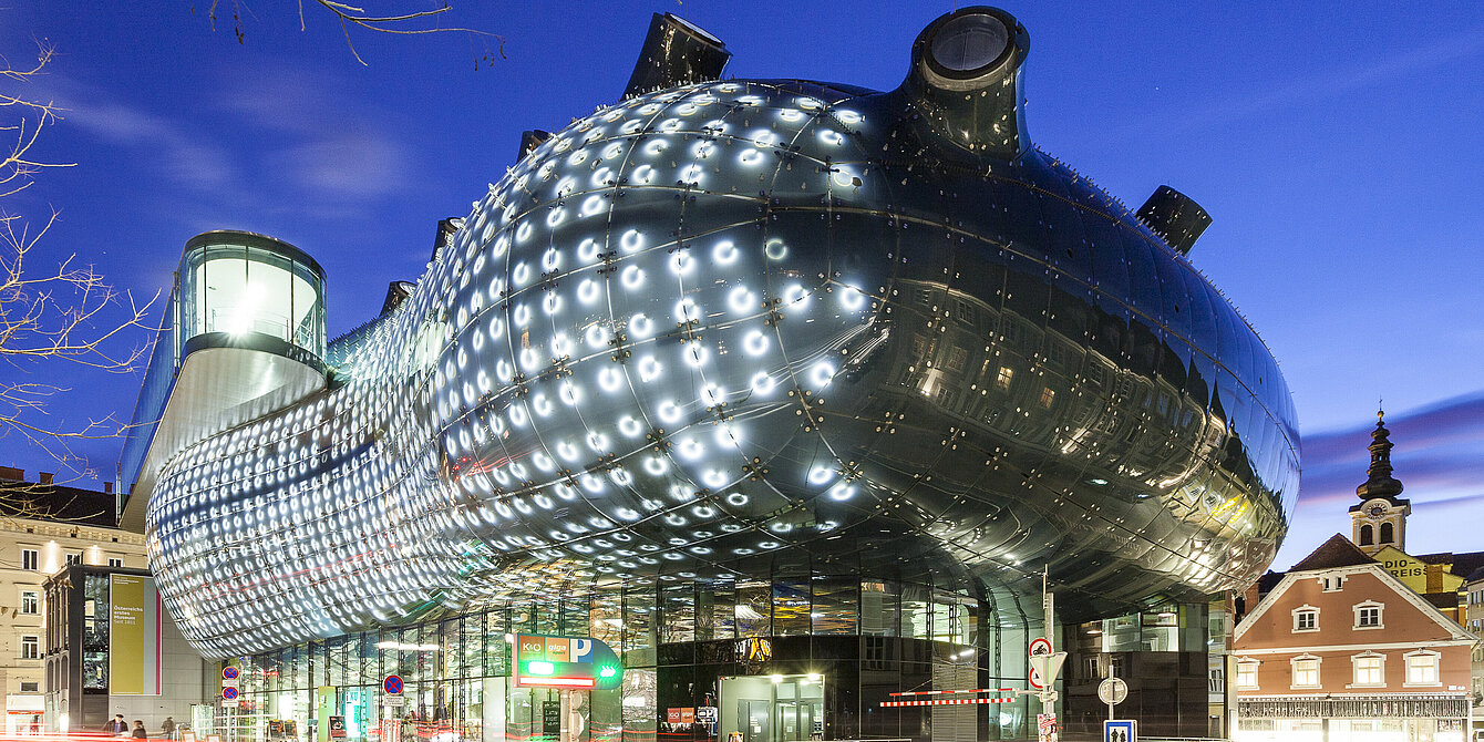 View of the Kunsthaus Graz at night. 