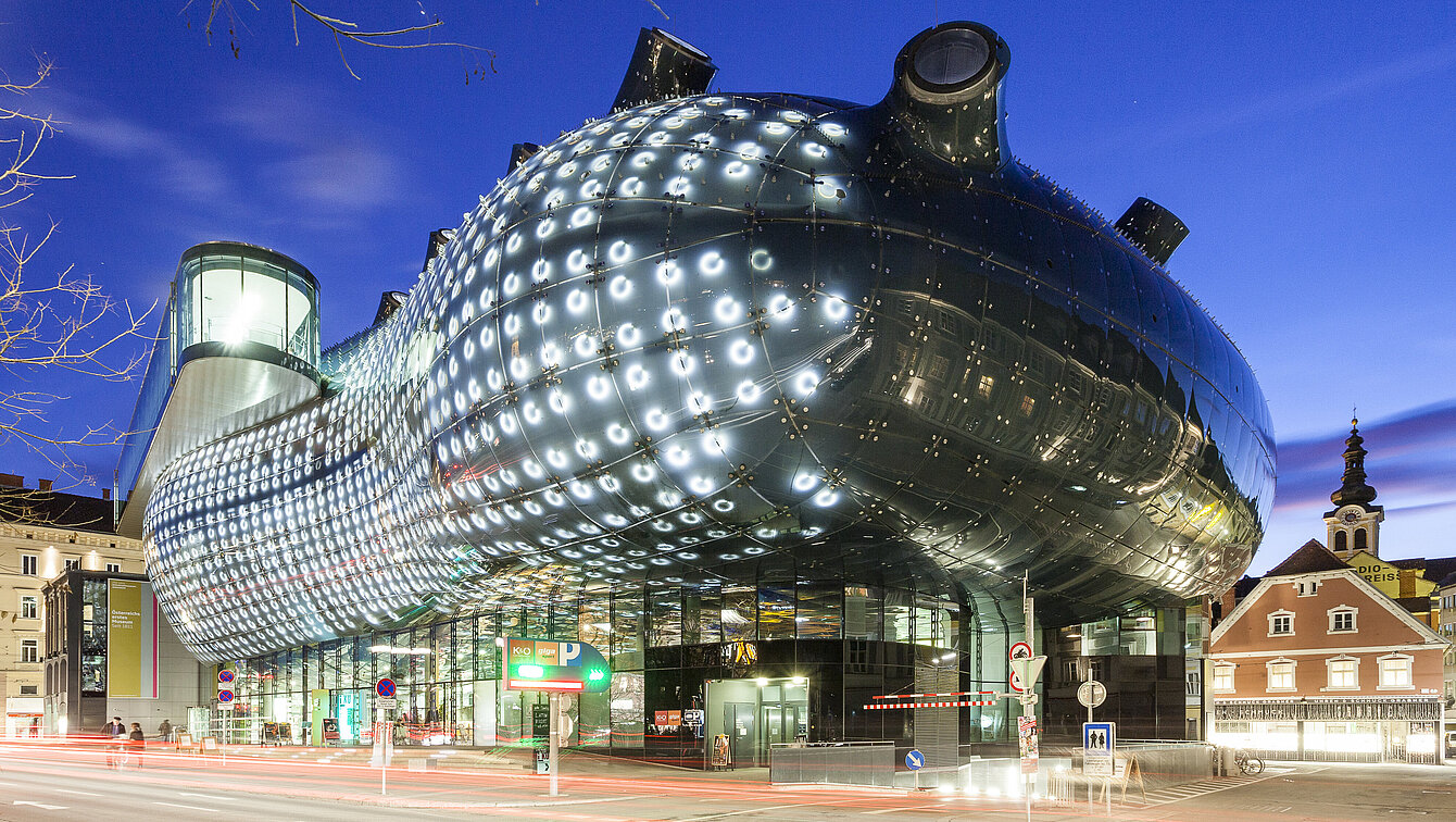 View of the Kunsthaus Graz at night. 