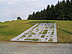 A steel plate with cut-out shapes is embedded in the way on a slope. The cut-outs are standardized symbols for elements in wet rooms. A human silhouette is also recognizable in Kupelwieser's bathroom.